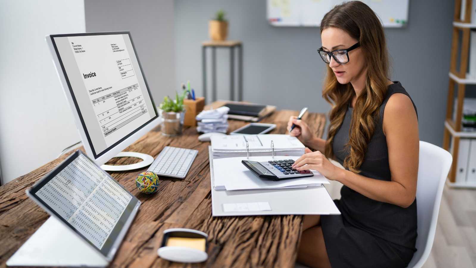 woman working on invoicing woman working on invoicing