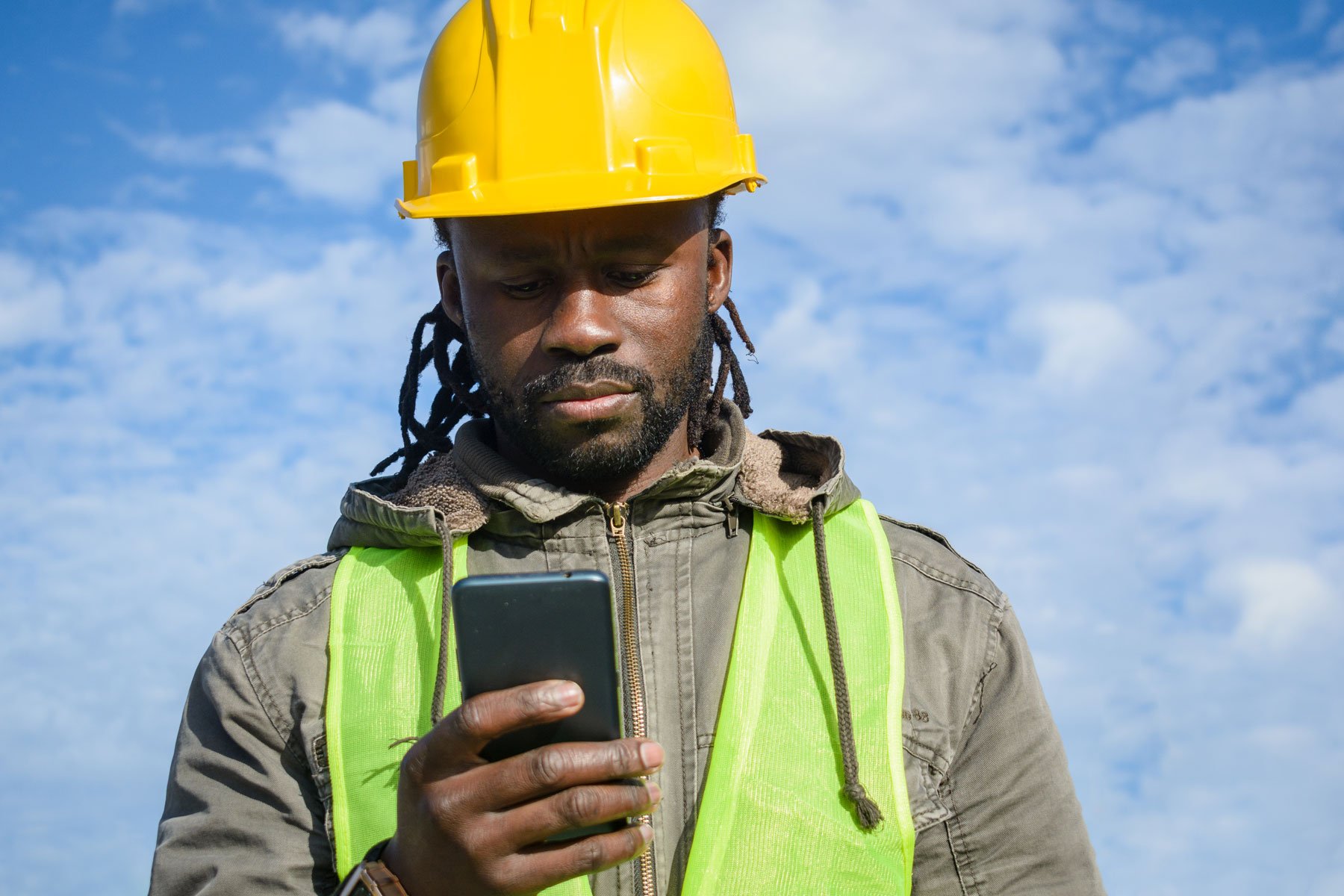 young black man construction worker outdoors