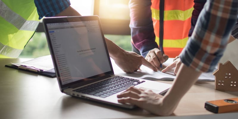 construction worker on laptop