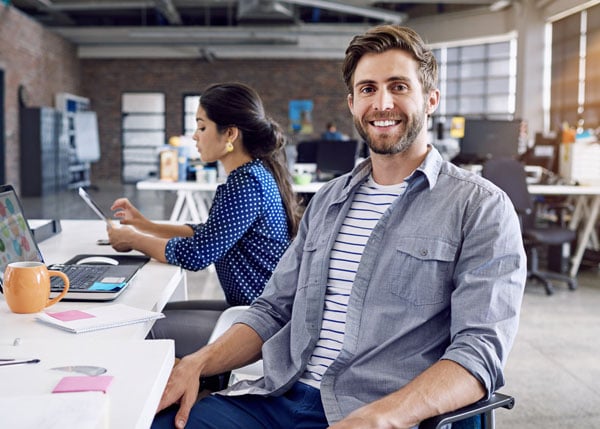 business casual professional sitting at desk