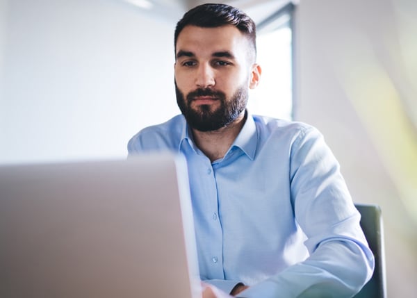 professional working in office on laptop