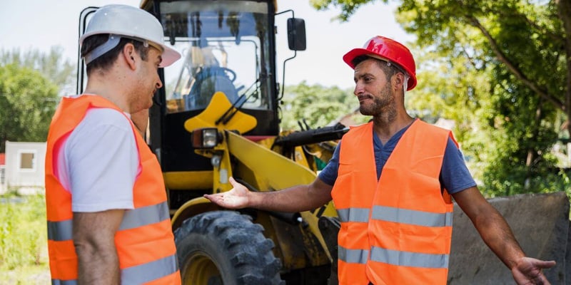 construction workers in a heated argument