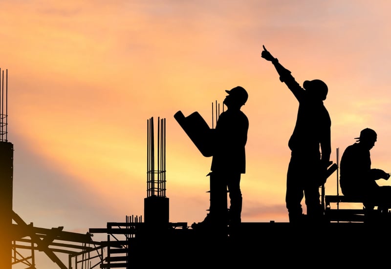 workers looking over construction plans