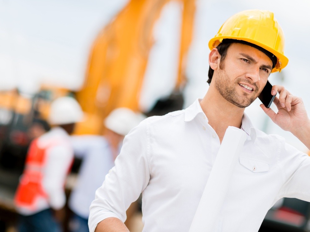 Engineer talking on the phone on a construction site