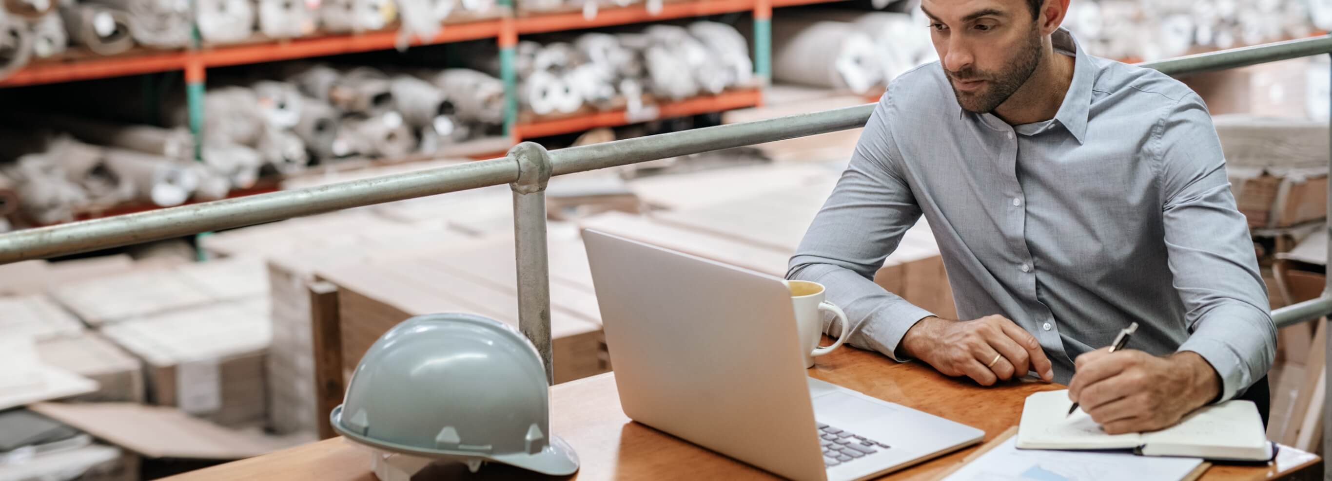 Warehouse worker taking notes